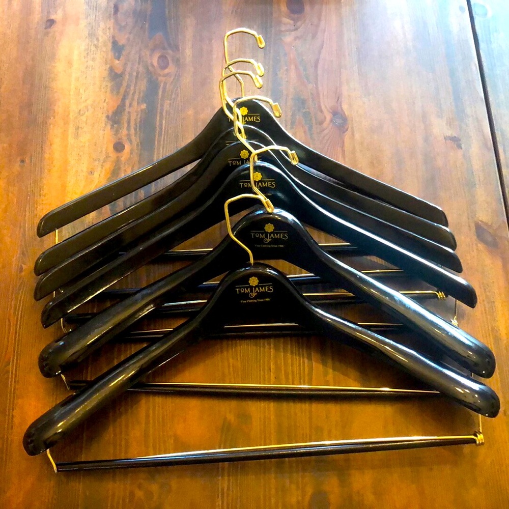 Beautiful black wooden suit hangers. 2 Wide Shoulder and 4 suit hangers.